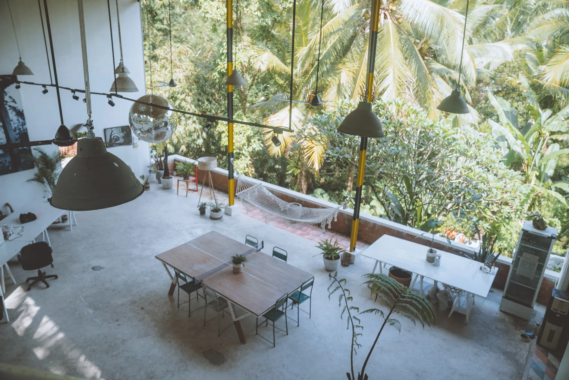 The open AIR studio in Ubud, surrounded by tropical trees.