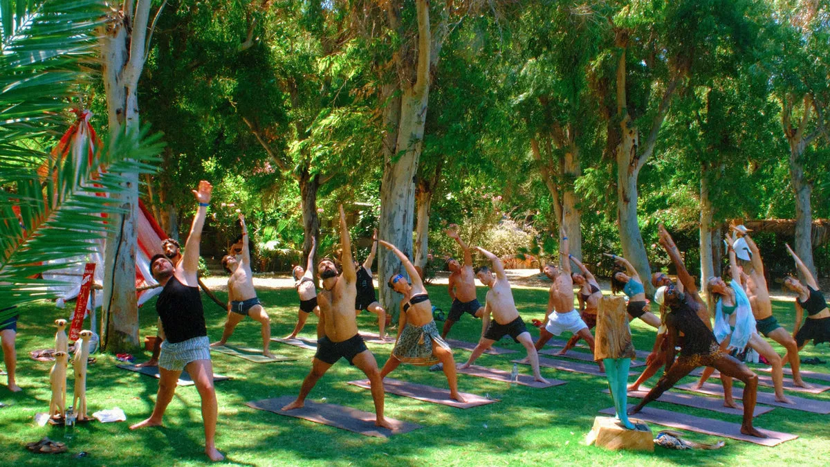 Morning yoga on the lawn under the trees at Bonjuk Bay