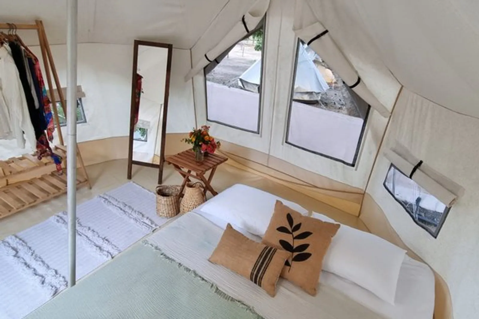 Glamping: tent interior with windows onto the camp