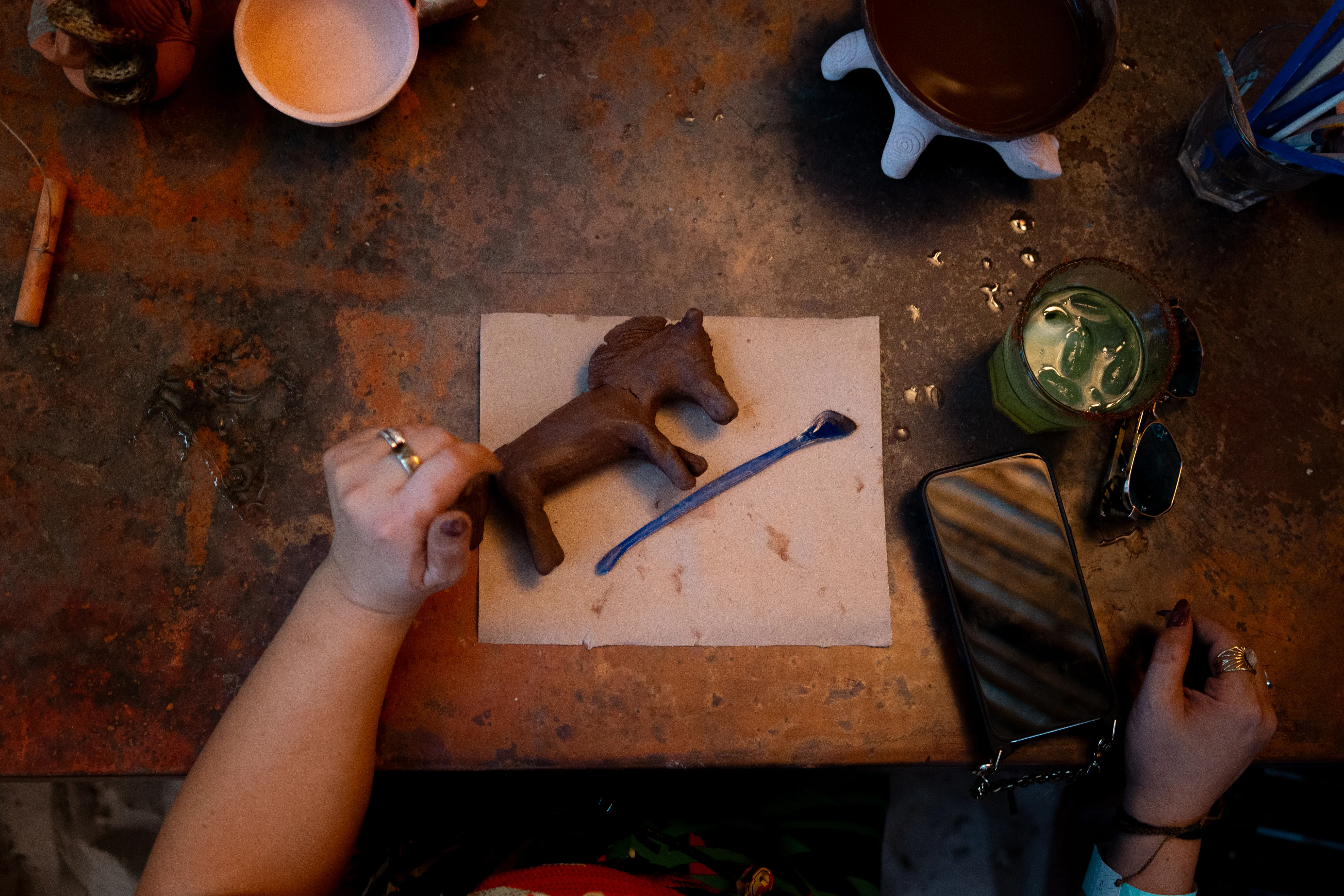 A small clay horse takes shape