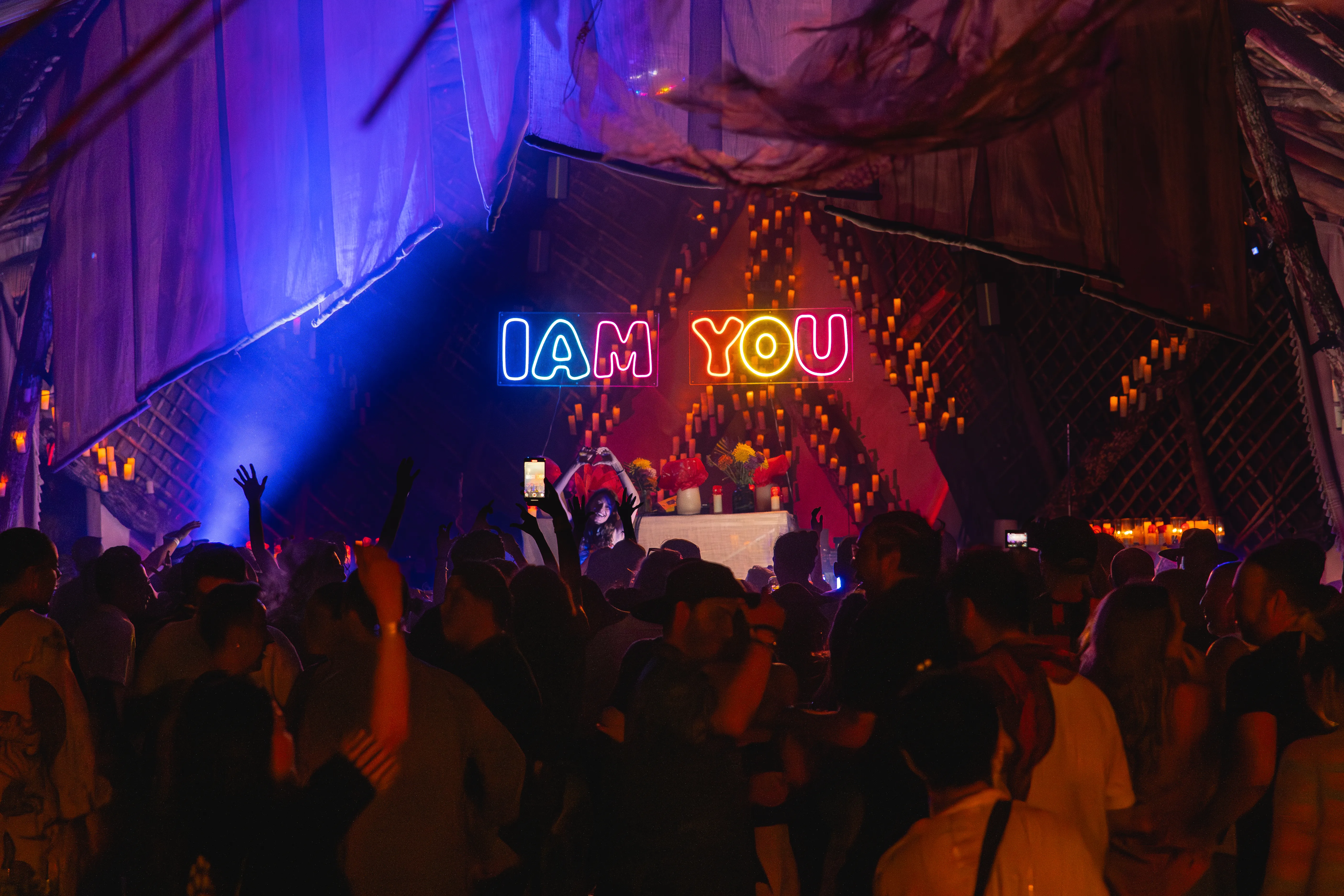 Under the I AM YOU lights