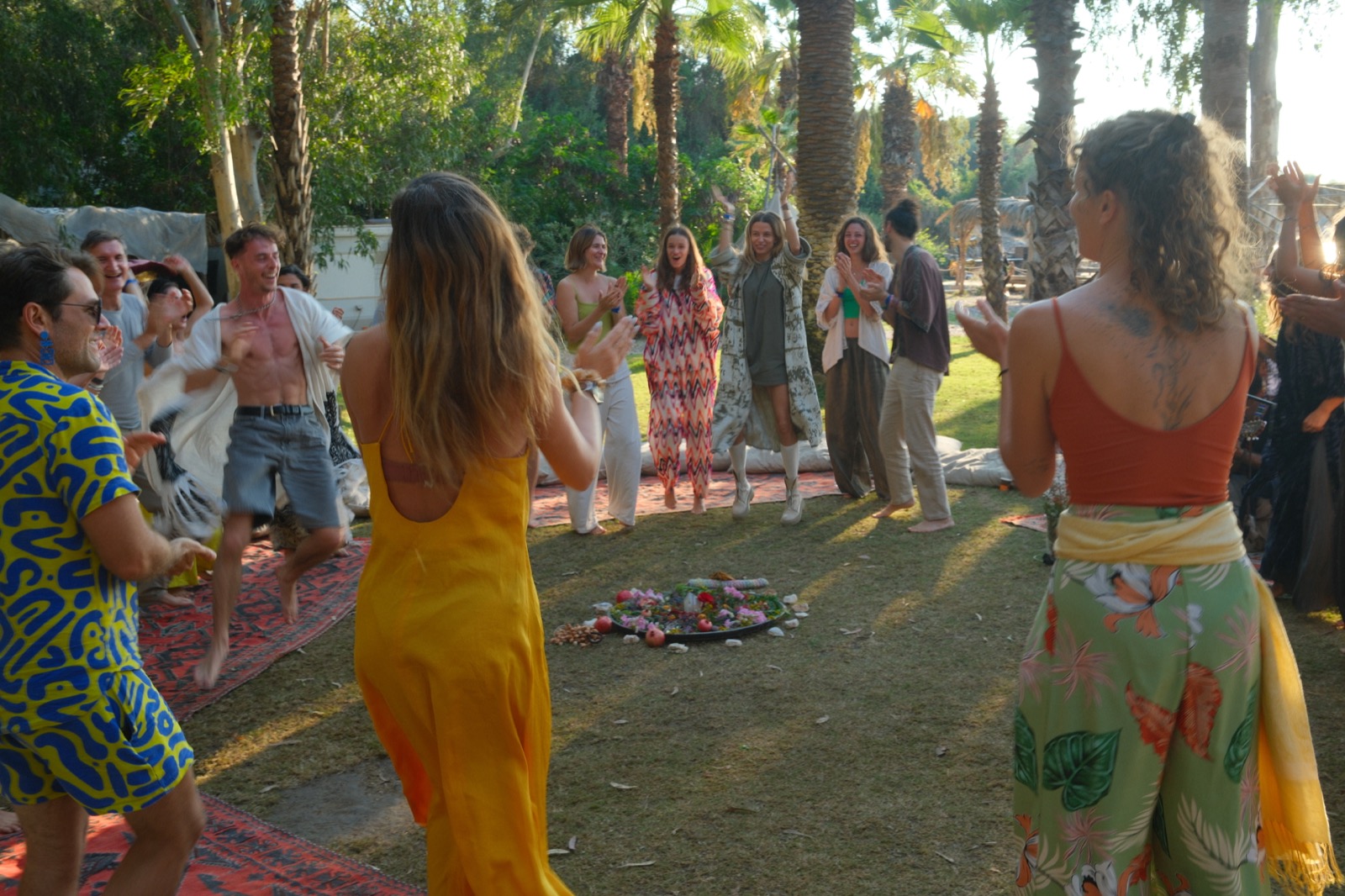An outdoor gathering beneath the palms